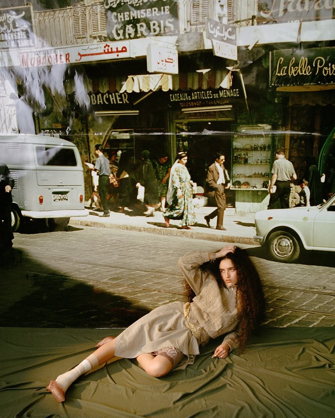 Medina editorial — model reclining before a vintage Beirut street backdrop